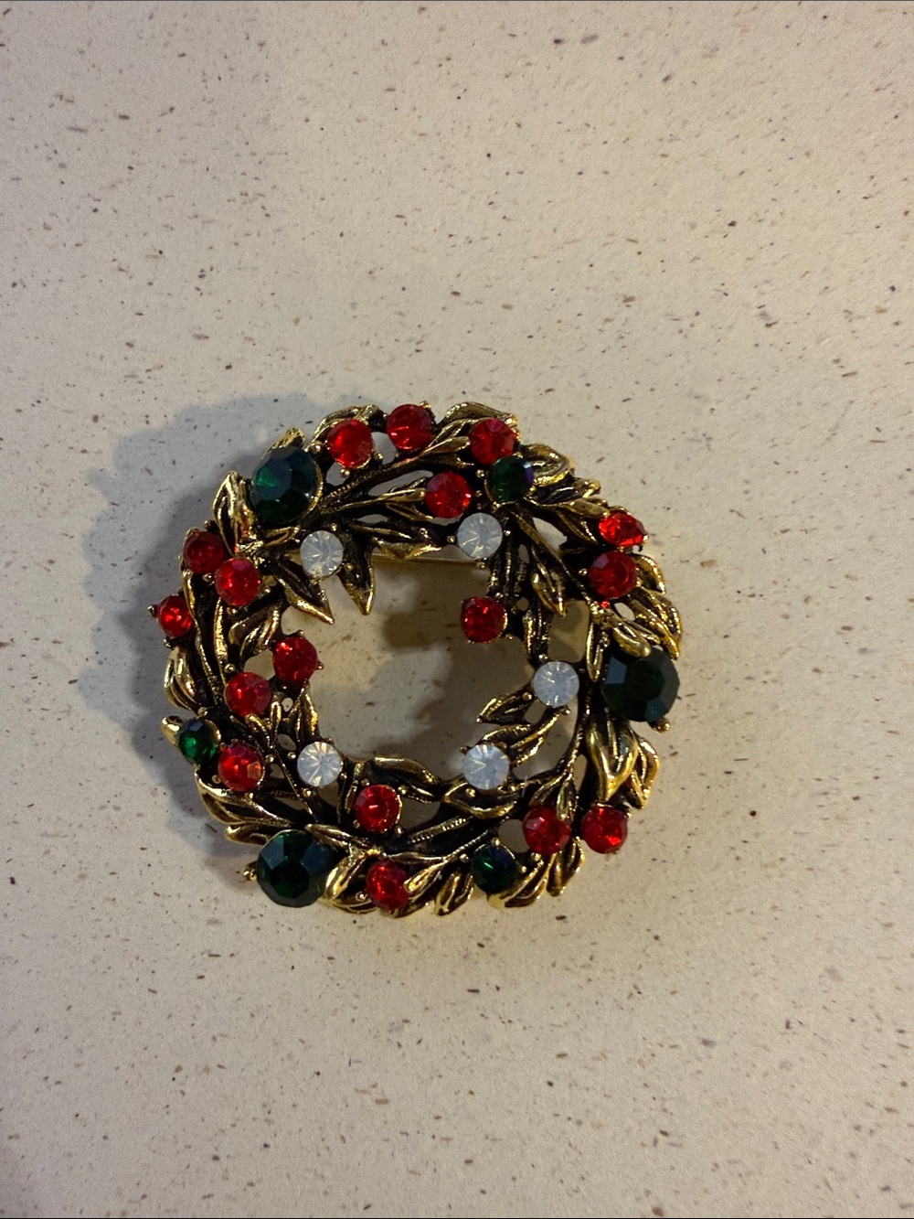 Gold-Tone Holiday Wreath Brooch with Red, Green & Clear Stones